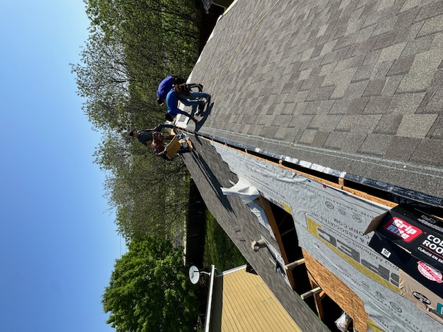 Waterloo RoofCo crew member on a completed roof project in Austin