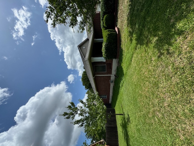 Completed roof closeup showing vent pipe and shingle detail