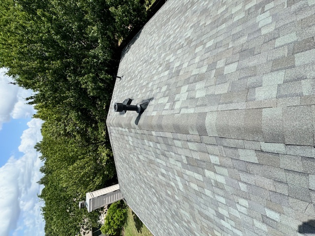 Completed brick home with new roof and landscaped yard